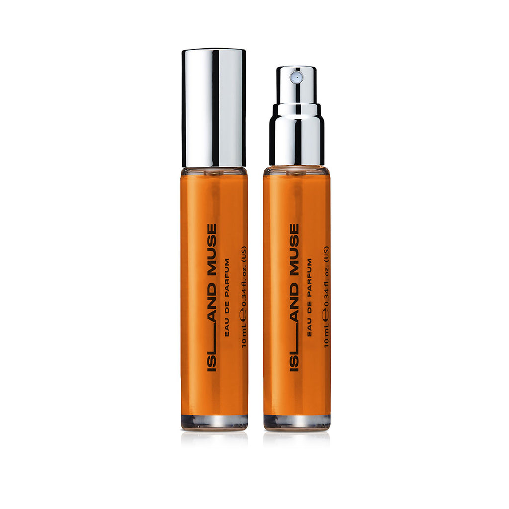 Two DON.BEAUTY Island Rose perfume bottles with silver caps on a white background