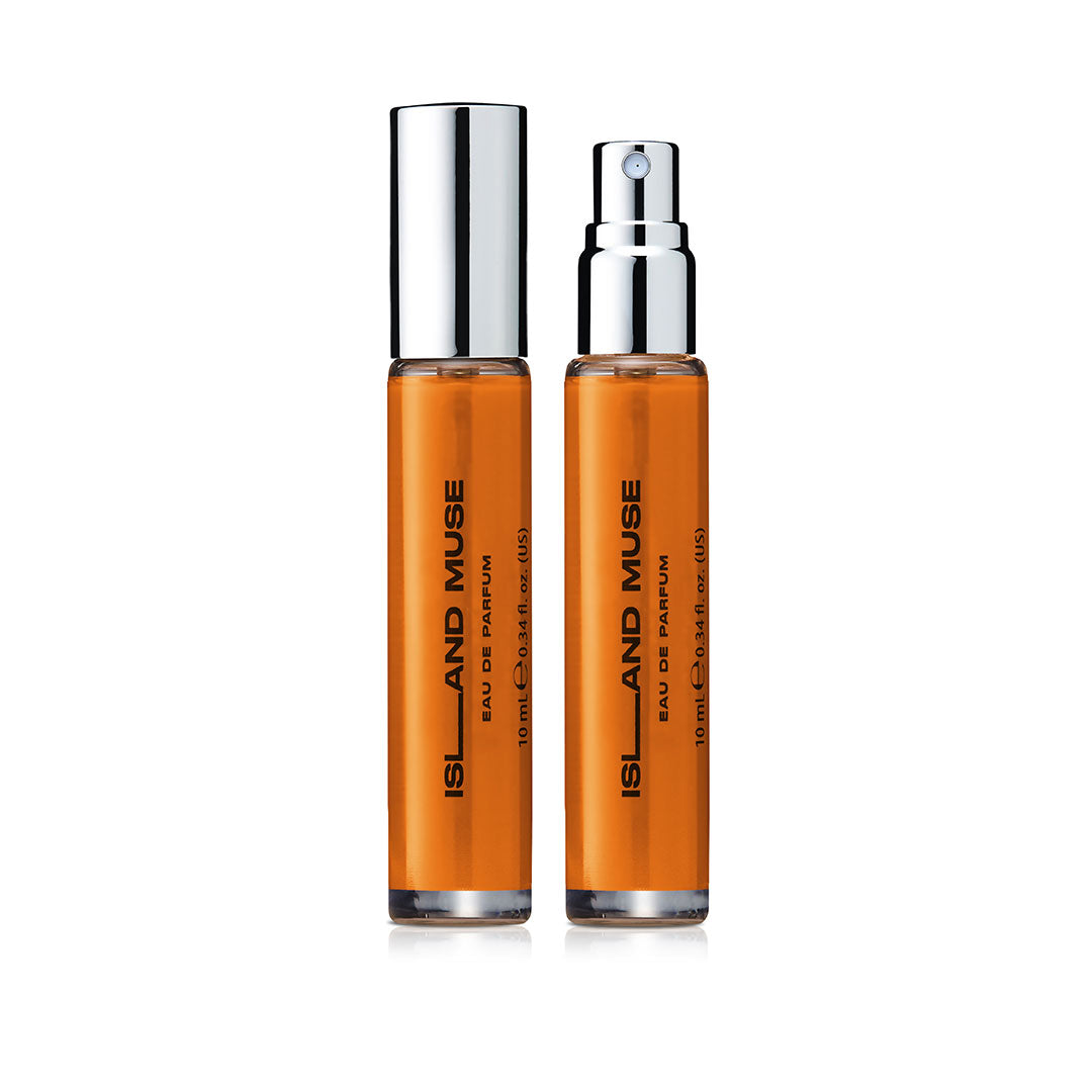 Two DON.BEAUTY Island Rose perfume bottles with silver caps on a white background