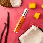 DON.BEAUTY Island Muse EPD on a pink background with coconut, vanilla bean, and pineapple pieces.