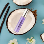 DON.BEAUTY Neroli Silk bottle on a coconut shell with vanilla beans and flowers on a blue background